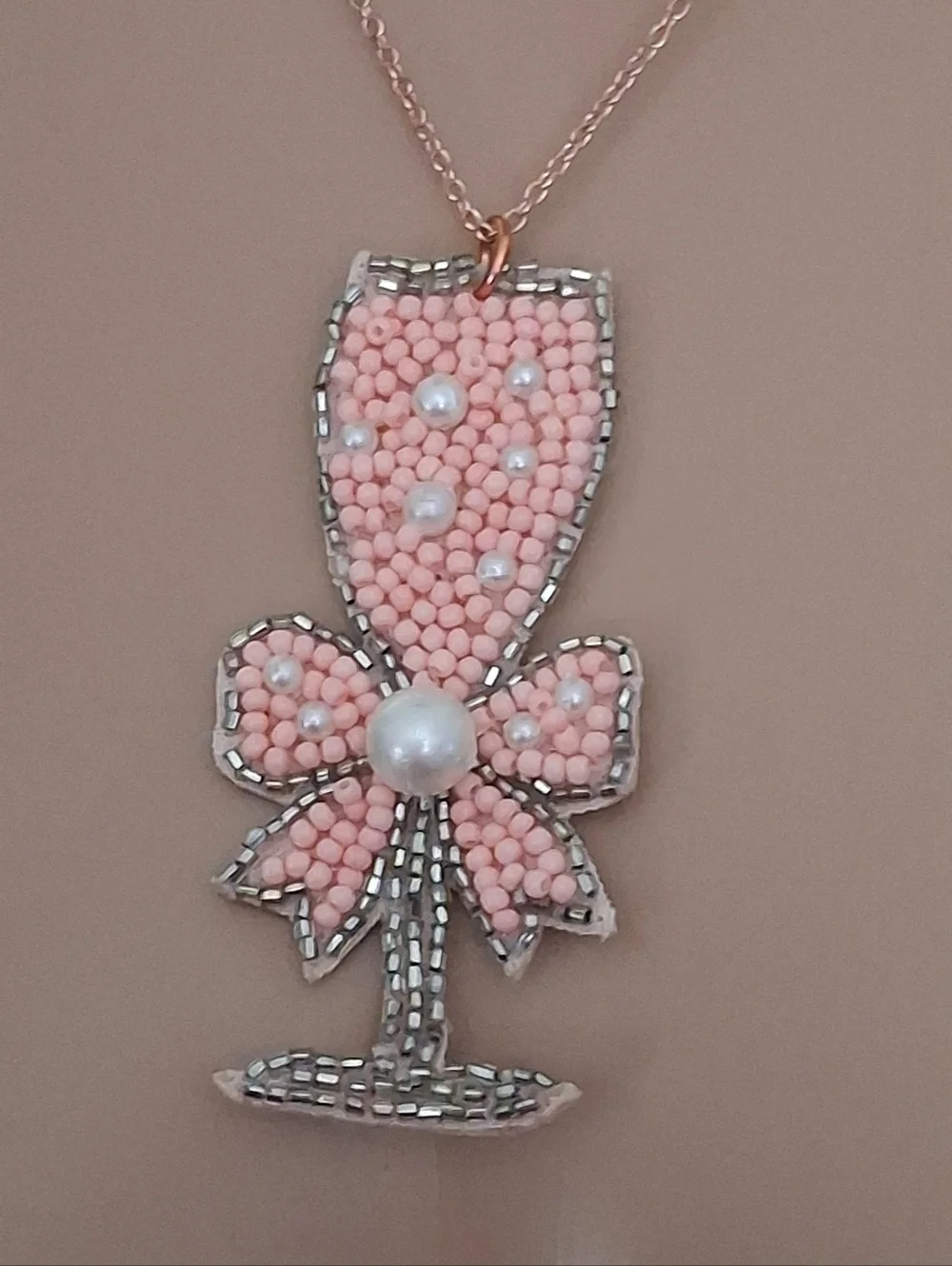 Pink Beaded Champagne Glass Pendant Necklace On A Rose Gold Chain.